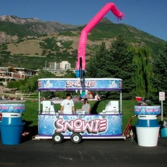 Snowie Trailer at an event with Green Hills behind.